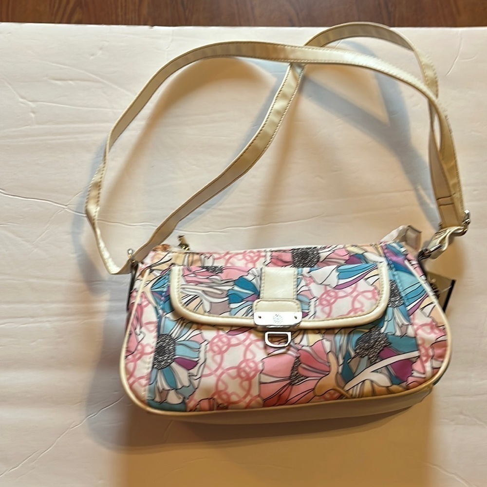 Treviso-floral hand bag with Adjustable strap. Never used dead stock.purse